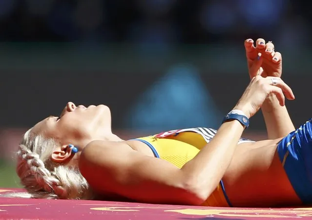 Erika Kinsey of Sweden reacts as she competes in the women's high jump qualifying round during the 15th IAAF World Championships at the National Stadium in Beijing, China, August 27, 2015. (Photo by David Gray/Reuters)