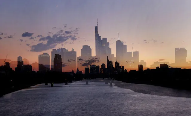 The sun sets behind the skyline of Frankfurt, Germany, July 3, 2022. Picture taken with zoom effect during long time exposure. (Photo by Kai Pfaffenbach/Reuters)