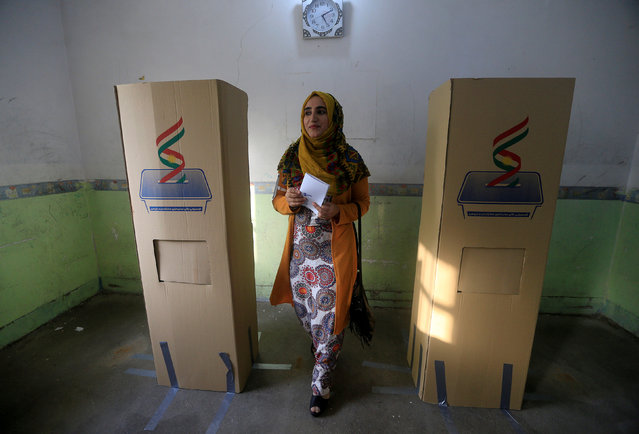 A woman casts her vote during Kurds independence referendum in Halabja, Iraq September 25, 2017. (Photo by Alaa Al-Marjani/Reuters)