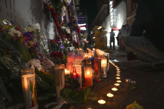 Flowers and votive candles line a memorial for the victims of a deadly truck attack on New Year's Day in New Orleans, Friday, January 3, 2025. (Photo by Gerald Herbert/AP Photo)