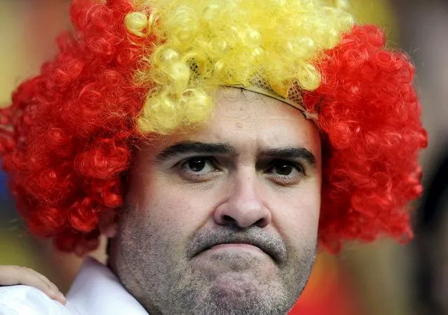 A supporter of the Spanish soccer team waits for the start of the Euro 2016 qualification soccer match between Spain and Slovakia at Carlos Tartiere stadium in Oviedo, Spain, September 5, 2015. (Photo by Eloy Alonso/Reuters)