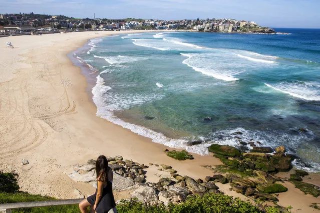 A general view of a closed Bondi Beach is seen on March 22, 2020 in Sydney, Australia. Prime Minister Scott Morrison on Friday introduced further measures to help stop the spread of coronavirus (COVID-19), implementing new rules limiting the number of people inside a venue to one every 4 square metres. Non-essential gatherings of 100 or more people indoors are banned, along with outdoor gatherings of more than 500 people in a bid to contain the spread of COVID-19. A travel ban on all visitors who are not Australian citizens or residents or their direct relations arriving into the country is now in place. There are now 1286 confirmed cases of COVID-19 In Australia and 7 deaths. (Photo by Jenny Evans/Getty Images)