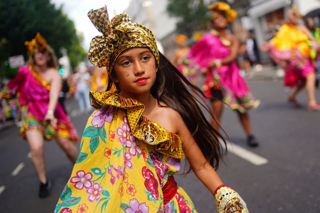 Performers during the Family Day at the Notting Hill Carnival in London on Sunday, August 28, 2022, which returned to the streets for the first time on two years, after it was thwarted by the pandemic. (Photo by Victoria Jones/PA Wire)