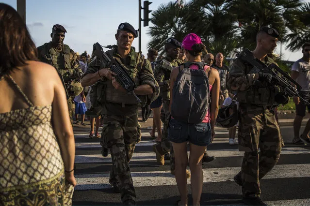 French soldiers patrol the Promenade des Anglais on August 4, 2016 in Nice, France. Security along the French Riviera and across France has been stepped up following the recent terrorist attacks. On July 14, a French-Tunisian attacker killed 84 people as he drove a lorry along the Promenade through crowds who had gathered to watch a firework display during Bastille Day Celebrations. The attacker then opened fire on people in the crowd before being shot dead by police. (Photo by Dan Kitwood/Getty Images)