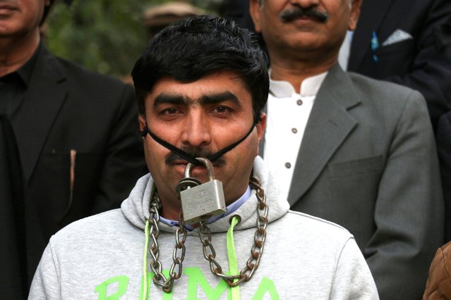 A Pakistani journalist wearing a chain lock takes part in a protest rally against the amendments of the Prevention of Electronic Crimes Act (PECA), in Islamabad, Pakistan, 31 January 2025. The controversial PECA amendments, making changes to the country's cybercrime laws that would criminalize 'fake news' on social media platforms, passed by the National Assembly this week have been criticized for potentially restricting press freedom. (Photo by Sohail Shahzad/EPA/EFE)