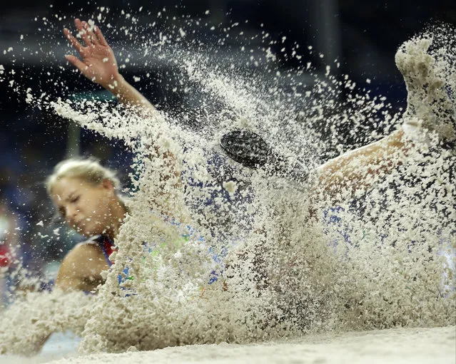 Russia's Darya Klishina makes an attempt in the women's long jump qualification during the athletics competitions of the 2016 Summer Olympics at the Olympic stadium in Rio de Janeiro, Brazil, Tuesday, August 16, 2016. (Photo by Matt Slocum/AP Photo)