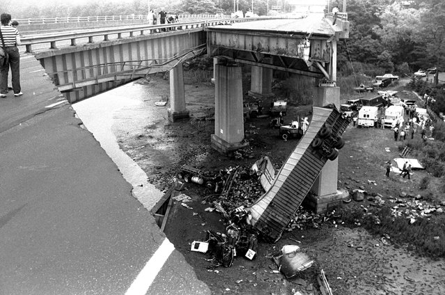 A 100-foot-long section of the Interstate 95 bridge spanning the Mianus River in Greenwich, CT, collapsed June 29, 1983.  Three people were killed and three were seriously injured when their vehicles plunged 70 feet to the river. (Photo by Bob Child/AP Photo)