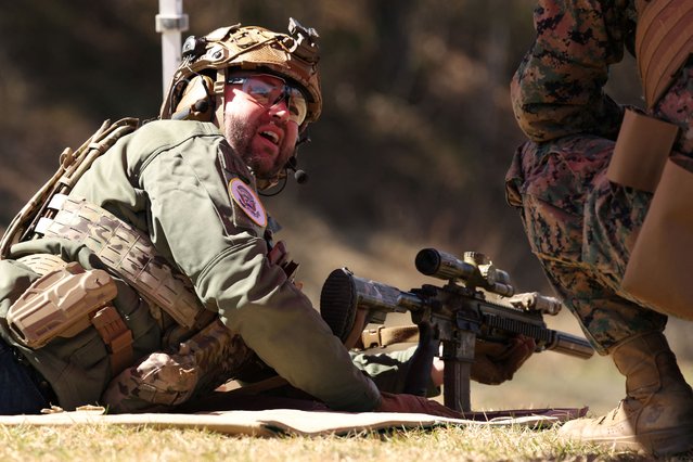 U.S. Vice President JD Vance holds a firearm in a shooting range during a visit to Marine Corps Base Quantico in Quantico, Virginia on March 26, 2025. (Photo by Kevin Lamarque/Reuters)