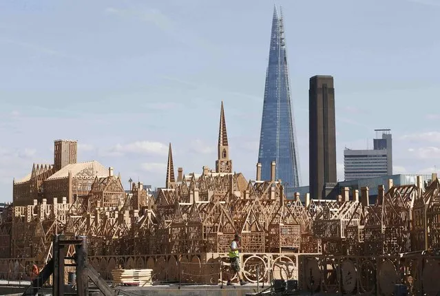 A 120-metre long sculpture of a 17th-century London skyline is completed for an event where it will be set alight, re-telling the story of the 1666 Great Fire of London, in London, Britain August 30, 2016. (Photo by Peter Nicholls/Reuters)