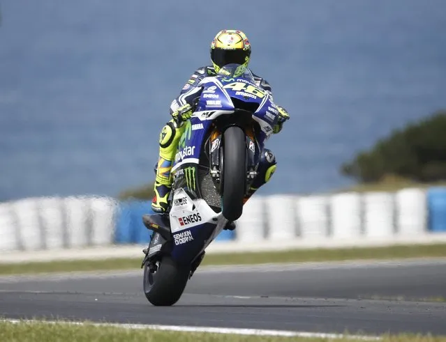 Yamaha MotoGP riader Valentino Rossi of Italy performs a wheelie during the a practice sesson for the Australian Grand Prix on Phillip Island October 18, 2014. (Photo by Jason Reed/Reuters)