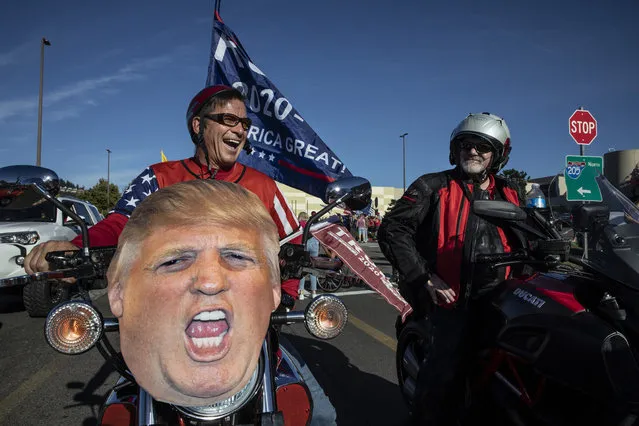 Supporters of President Donald Trump attend a rally and car parade Saturday, August 29, 2020, from Clackamas to Portland, Ore. (Photo by Paula Bronstein/AP Photo)