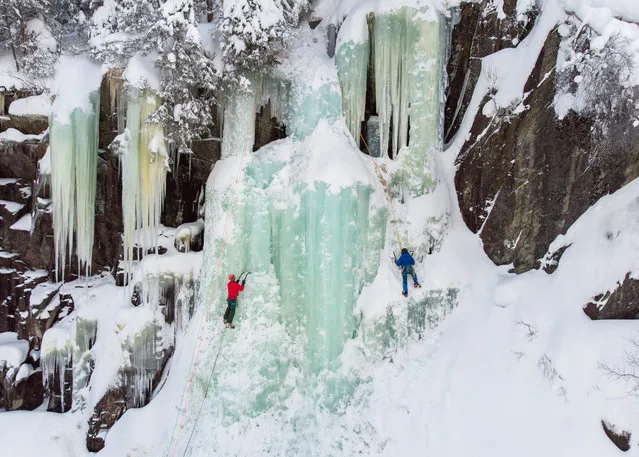 Ice climbers in action near Rjukan, Norway, 13 February 2018 (issued 14 February 2018). (Photo by Balazs Mohai/EPA/EFE)