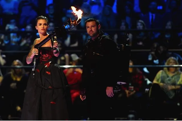 Co-host actress Ruby Rose blows a fire gun on stage during the MTV EMA's 2015 at the Mediolanum Forum on October 25, 2015 in Milan, Italy. (Photo by Brian Rasic/Getty Images for MTV)