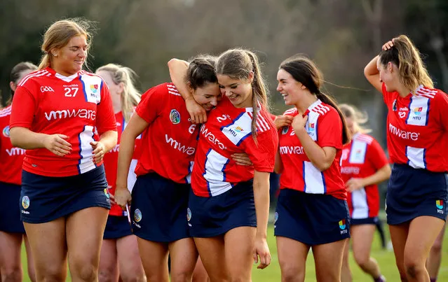 MTU Cork’s Saoirse McCarthy and Aoife O’Neill celebrate with teammates after defeating University of Galway in the Electric Ireland Purcell Cup Final, at UCD in Dublin on February 12, 2023. (Photo by Ryan Byrne/Inpho)