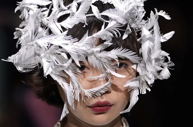 A model displays a creation by Ohalu Ando of Japan during the 2018 Autumn/Winter Collection at the Tokyo Fashion Week in Tokyo, Tuesday, March 20, 2018. (Photo by Shizuo Kambayashi/AP Photo)
