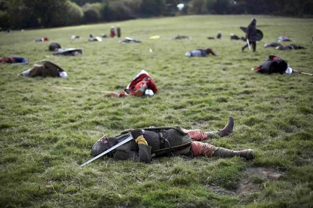 Re-enactors participate in a demonstration before a re-enactment of the the Battle of Hastings on the 950th anniversary of the battle, in Battle, Britain October 15, 2016. (Photo by Neil Hall/Reuters)