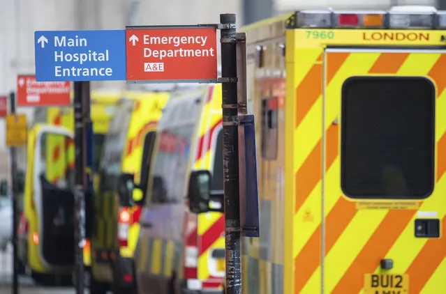 Ambulances outside the Royal London Hospital, in London, Tuesday December 29, 2020. England Health Service figures show hospitals now have more Covid-19 patients than during April's first-wave peak, with fears of increased figures because of a Christmas social spread. (Photo by Dominic Lipinski/PA Wire via AP Photo)