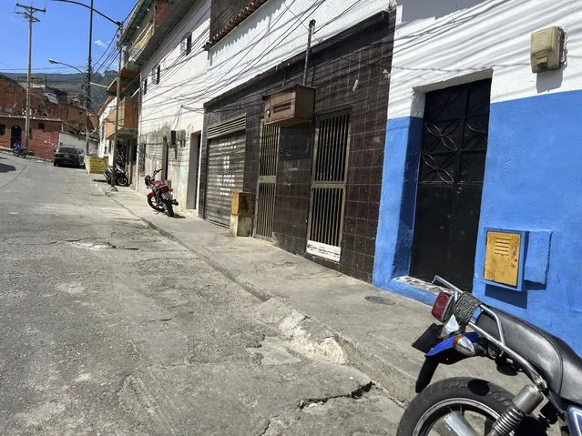 The second house from right to left, with a “No Parking” sign in Spanish on the door of its garage is the listed address of one of the startups involved in a massive corruption scandal that bilked billions of dollars in Venezuelan oil, and whose owner has never heard of the firm, at a working-class district in Caracas, Venezuela, Tuesday, March 28, 2023. The corporation, Walker International DW-LLC, is among 90 mostly unknown trading companies that together owed $10.1 billion as of Aug. 2022 to Venezuela’s state-owned oil giant Petroleos de Venezuela SA, according to internal records obtained by The Associated Press. (Photo by Regina Garcia Cano/AP Photo)
