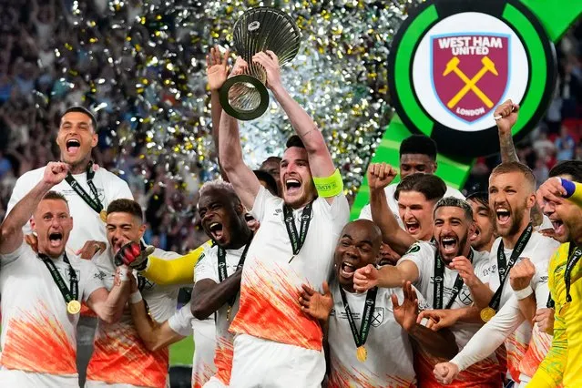 West Ham's Declan Rice lifts the trophy after winning the Europa Conference League final soccer match between Fiorentina and West Ham at the Eden Arena in Prague, Wednesday, June 7, 2023. West Ham won 2-1. (Photo by Petr David Josek/AP Photo)