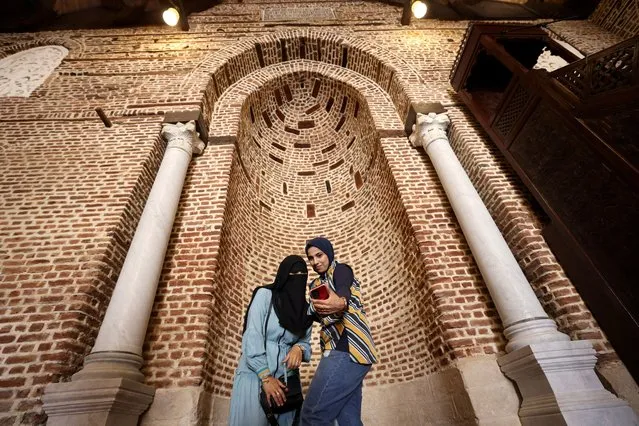 Women take selfie inside the historic Mosque of al-Zahir Baybars, that was built in 1268 by the Mamluk Sultan al-Zahir Baybars al-Bunduqdari, as Egypt reopens it after the completion of renovation work, in Cairo, Egypt on June 5, 2023. (Photo by Mohamed Abd El Ghany/Reuters)