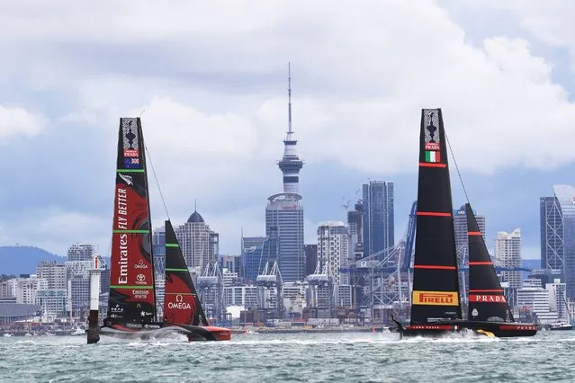 Italy's Luna Rossa (R) competes against Team New Zealand during day six of the America's Cup in Auckland on March 16, 2021. (Photo by Gilles Martin-Raget/AFP Photo)