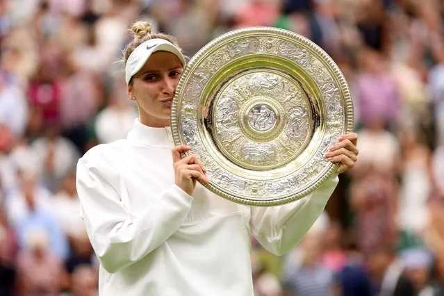 Marketa Vondrousova of Czech Republic lifts the Women's Singles Trophy following her victory in the Women's Singles Final against Ons Jabeur of Tunisia on day thirteen of The Championships Wimbledon 2023 at All England Lawn Tennis and Croquet Club on July 15, 2023 in London, England. (Photo by Clive Brunskill/Getty Images)