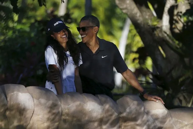 U.S. President Barack Obama laughs with his daughter Malia as they visit the Honolulu Zoo in Honolulu, Hawaii January 2, 2016. (Photo by Jonathan Ernst/Reuters)