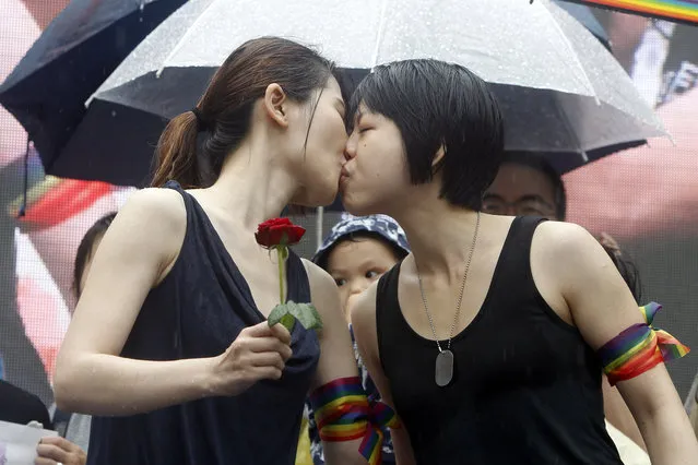 Same-sеx marriage supporters kiss outside the Legislative Yuan Friday, May 17, 2019, in Taipei, Taiwan after the legislature passed a law allowing same-sеx marriage in a first for Asia. (Photo by Chiang Ying-ying/AP Photo)