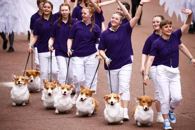 People with plush Corgi dogs take part in a parade during the Platinum Jubilee Pageant, marking the end of the celebrations for the Platinum Jubilee of Britain's Queen Elizabeth, in London, June 5, 2022. (Photo by Henry Nicholls/Reuters)