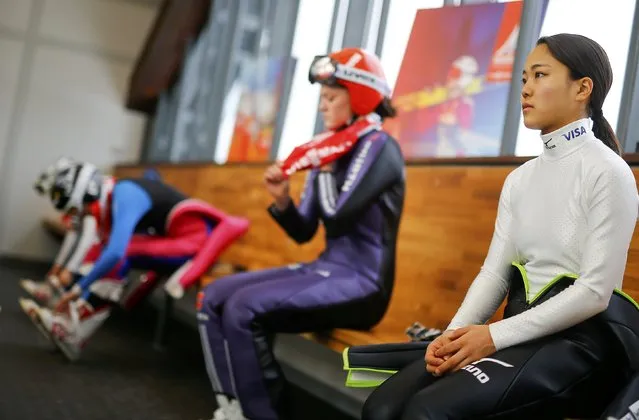 Sara Takanashi of Japan (R) prepares for a training session of the women's Individual normal hill HS100 ski jumping at the Nordic World Ski Championships in Falun February 18, 2015. (Photo by Kai Pfaffenbach/Reuters)