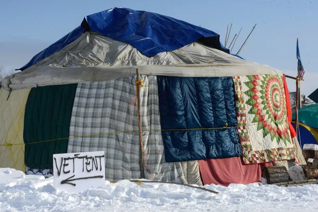 A sign pointing to the veterans tent is seen in Oceti Sakowin camp as “water protectors” continue to demonstrate against plans to pass the Dakota Access pipeline near the Standing Rock Indian Reservation, near Cannon Ball, North Dakota, U.S. December 3, 2016. (Photo by Stephanie Keith/Reuters)