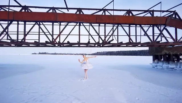 Ballet dancer from the Mariinsky Theatre Ilmira Bagautdinova performs on the ice of frozen Batareynaya Bay to protest the construction of a grain terminal and other infrastructure in the Gulf of Finland, in Leningrad region, Russia, in this still image taken from video released on February 20, 2021. (Photo by Ilmira Bagautdinova/Reuters TV)