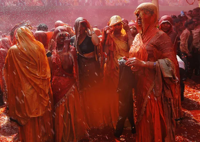 Women daubed in coloured water as they take part in “Huranga” at the Dauji temple, near the northern Indian city of Mathura, March 7, 2015. (Photo by Adnan Abidi/Reuters)