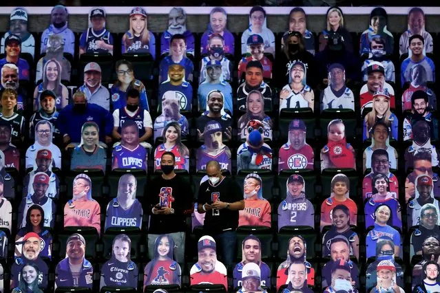 Clippers supporters are surrounded by cardboard cutouts of fans before game 5 of the NBA playoffs between the Dallas Mavericks and the Los Angeles Clippers at the Staples Center in Los Angeles, California, USA, 02 June 2021. (Photo by Etienne Laurent/EPA/EFE)