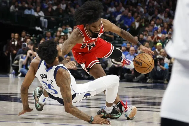 Coby White #0 of the Chicago Bulls is fouled by Derrick Jones Jr. #55 of the Dallas Mavericks in the second half at American Airlines Center on November 01, 2023 in Dallas, Texas. (Photo by Tim Heitman/Getty Images)