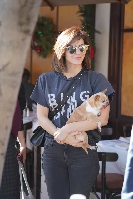 Katherine McPhee holds her pet chihuahua as she is seen after Lunch along side David Foster at El Pistaio Restaurant in Beverly Hills, California on December 20, 2018. (Photo by Shotbyjuliann/Splash News and Pictures)