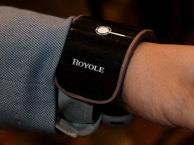 Royole Corp. CEO Zihong Liu demonstrates a Royole FlexPhone that is flexible enough to bend around one's wrist during a press event for CES 2017 at the Mandalay Bay Convention Center on January 4, 2017 in Las Vegas, Nevada. (Photo by Ethan Miller/Getty Images)