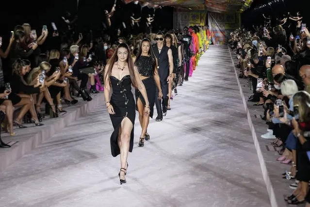 Gigi Hadid, from centre left, and Irina Shayk lead models as they wear creations for the Versace Spring Summer 2022 collection during Milan Fashion Week, in Milan, Italy, Friday, September 24, 2021. (Photo by Luca Bruno/AP Photo)