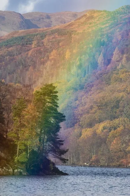 A vivid rainbow after a very heavy shower adding to the autumnal colour at Loch Katrine in Loch Lomond and the Trossachs National Park, Scotland on November 8, 2023. (Photo by Kay Roxby/Alamy Live News)