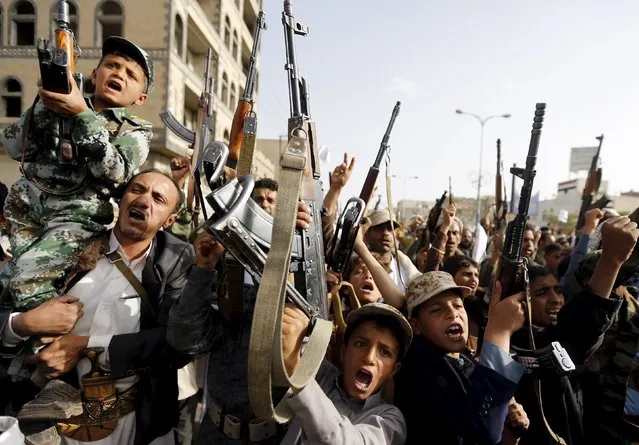 Boys supporting the Houthi group hold up rifles as they shout slogans during a demonstration against the air strikes by the Saudi-led coalition in Sanaa April 27, 2015. Saudi-led aircraft pounded Iran-allied Houthi militiamen and rebel army units in central Yemen and the capital Sanaa on Monday despite a formal end to the air strikes, residents said, and a humanitarian crisis worsened as both sides blocked aid. (Photo by Khaled Abdullah/Reuters)