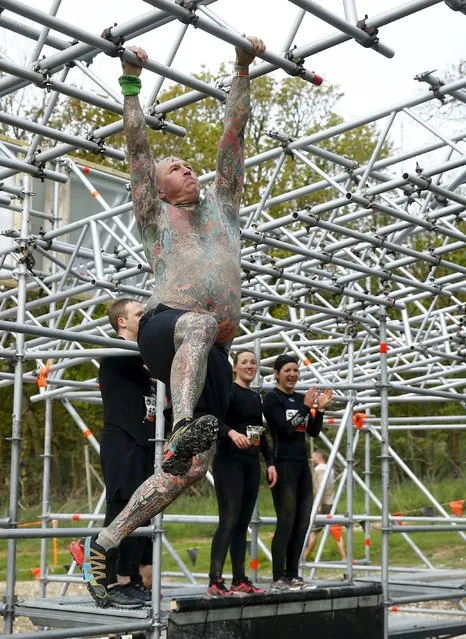 A competitor participates in the Tough Mudder challenge near Henley-on-Thames in southern England May 2, 2015. (Photo by Eddie Keogh/Reuters)