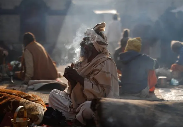 A Hindu holy man, or sadhu, smokes marijuana at the premises of Pashupatinath Temple, during the Shivaratri festival, in Kathmandu, Nepal, on March 8, 2024. (Photo by Navesh Chitrakar/Reuters)
