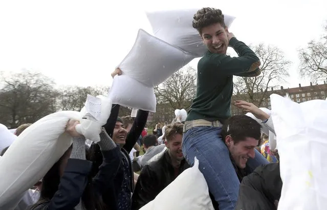 Participants take part in International Pillow Fight Day in Kennington Park in south London, Britain April 2, 2016. (Photo by Neil Hall/Reuters)