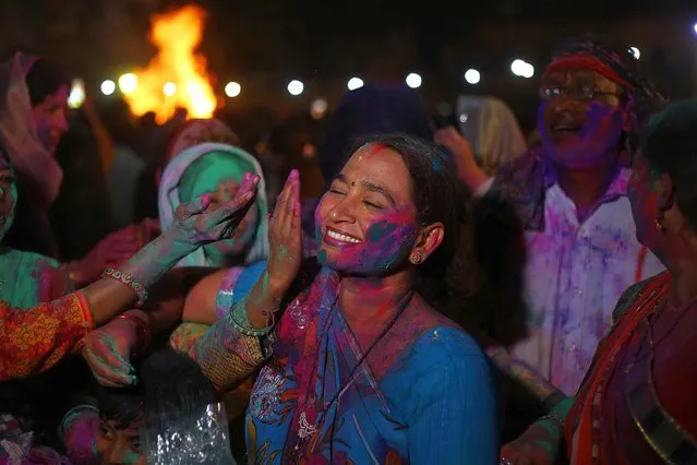 Members of the Pakistani Hindu community, with their faces painted or otherwise stained in colors, celebrate the festival of Holi in Karachi, Pakistan, 24 March 2024. Holi, also known as the “Festival Of Colors”, is an ancient Hindu festival symbolizing the victory of good over evil and marking the arrival of spring with joyful gatherings during which revelers cover each other in colored powders. (Photo by Shahzaib Akber/EPA/EFE)