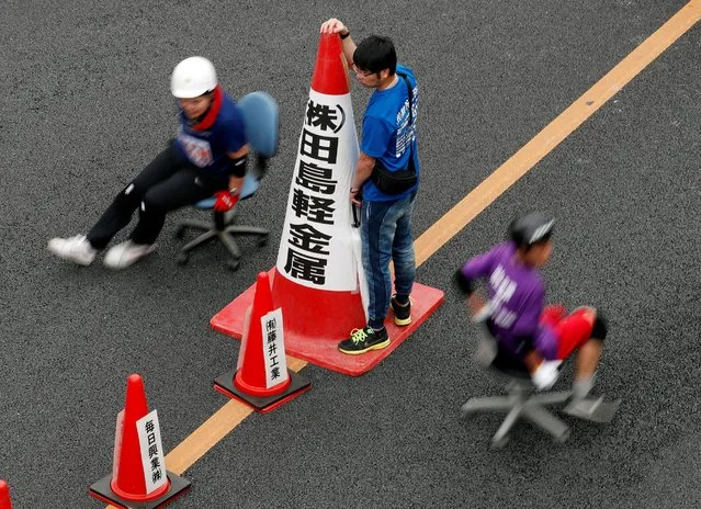 Racers compete during ISU-1 Hanyu Grand Prix, while taking part in the office chair race ISU-1 Grand Prix series, in Hanyu, north of Tokyo, Japan, June 9, 2019. (Photo by Issei Kato/Reuters)
