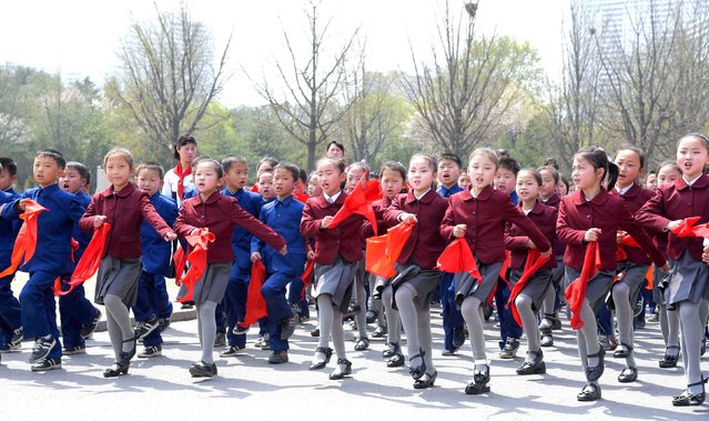 People take part in celebrations to commemorate the anniversary of the birth of North Korea's founding leader Kim Il Sung, at Changdok School in Pyongyang in this undated photo released by North Korea's Korean Central News Agency (KCNA) April 15, 2016. (Photo by Reuters/KCNA)