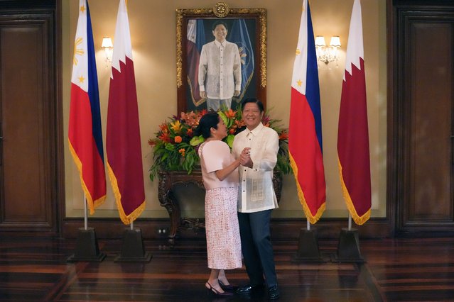 Philippine President Ferdinand Marcos Jr., right, briefly dances with First Lady Liza as they wait for Emir of Qatar, Sheikh Tamim Bin Hamad Al Thani at Malacanang Presidential palace Monday, April 22, 2024, in Manila, Philippines. (Photo by Aaron Favila/Pool via AP Photo)