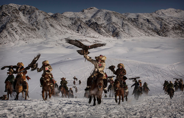Professional environment category winner. Eagle Hunters of Western China, by Kevin Frayer, Canada. The training and handling of large birds of prey follows a strict set of ancient rules that Kazakh eagle hunters are preserving for future generations in the mountainous region of western China that borders Kazakhstan, Russia and Mongolia. (Photo by Kevin Frayer/Getty Images)