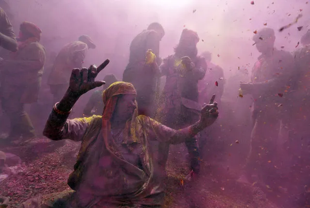 Widows take part in Holi celebrations in the town of Vrindavan in the northern state of Uttar Pradesh, India. (Photo by Cathal McNaughton/Reuters)
