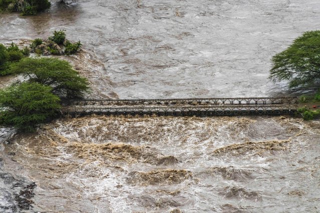 Flood waters cover a bridge in the flooded Maasai Mara National Reserve, that left dozens of tourists stranded in Narok County, Kenya, Wednesday, May 1, 2024. Kenya, along with other parts of East Africa, has been overwhelmed by flooding. (Photo by Bobby Neptune/AP Photo)